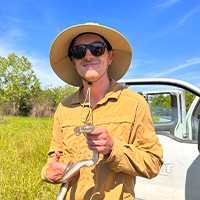 Cullen Mackenzie holding a snake