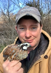 patrick holding a quail