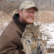 Dr Nielsen holding bobcat