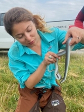 Anahit is holding a snake